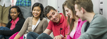 Five school students studying English together
